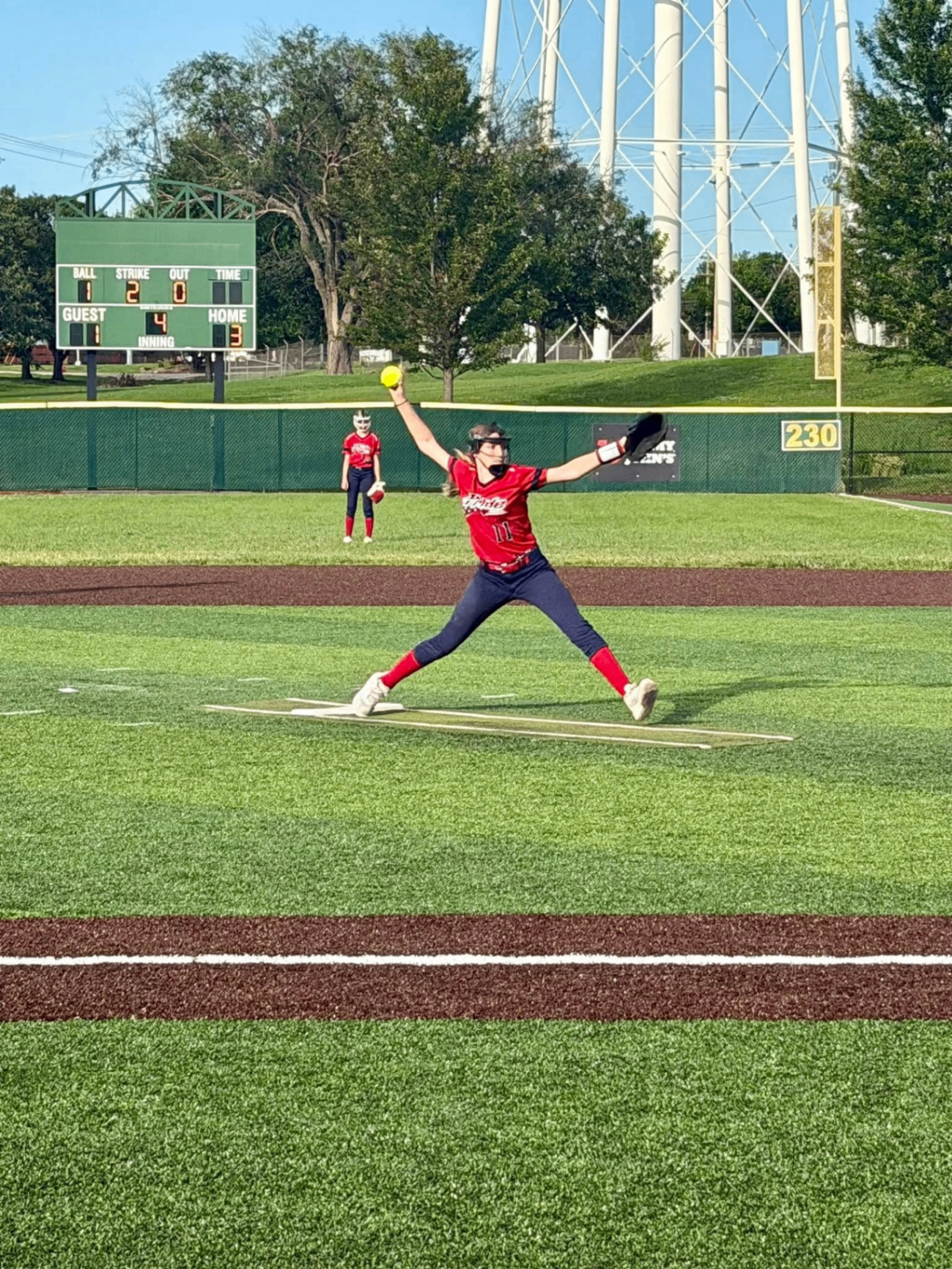 Pride pitcher delivering a pitch during game action